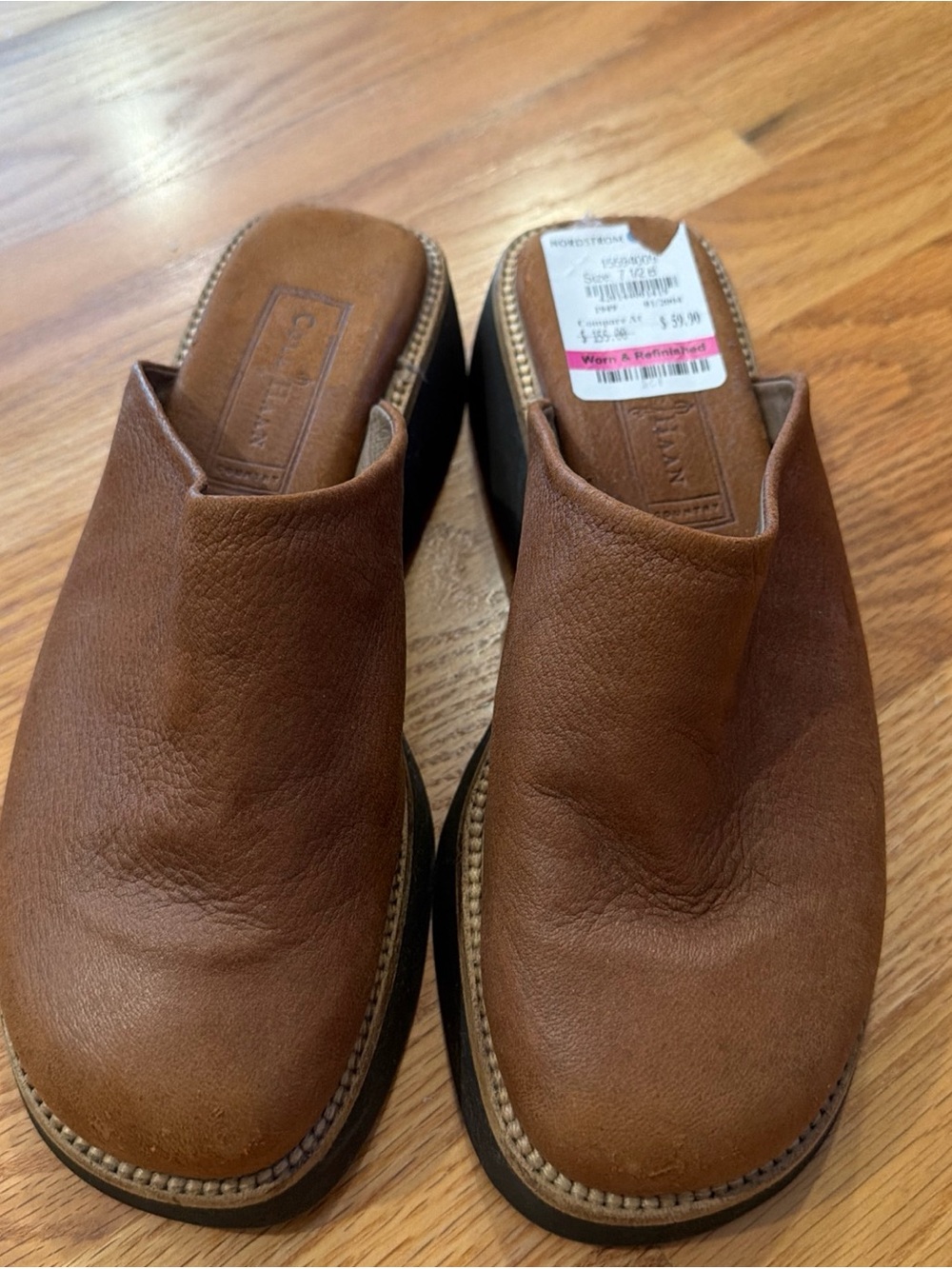 brown leather mules by Cole Haan feature a stacked block heel slip-on design 6.5